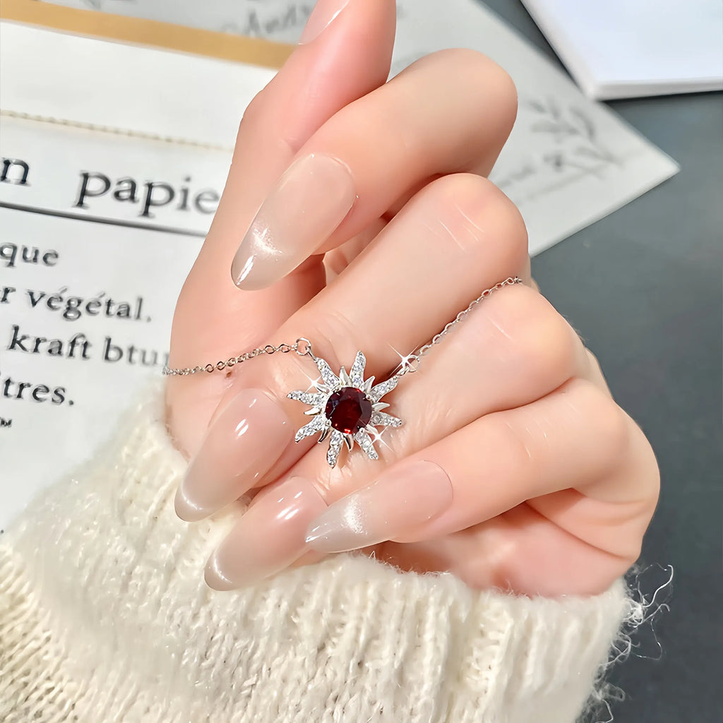 Sunburst Radiance Garnet Pendant Necklace in Sterling Silver